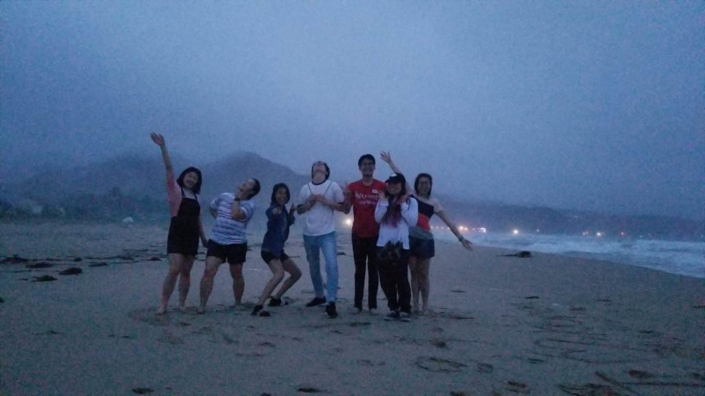Olivia and friends on the beach in Korea